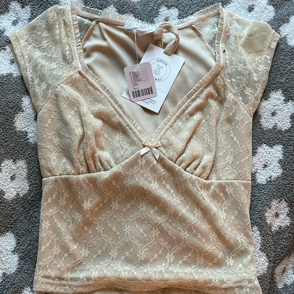 Cute cream colored top just ordered too many.